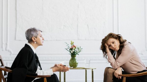 Stress and Burnout coaching at school - session of a coach with her female client, both sitting in their chairs